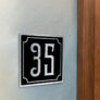 Contemporary Brushed Metal and Black Door Sign AD102-BSB